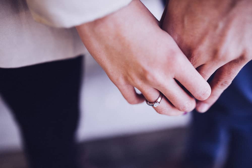 Couple holding hands